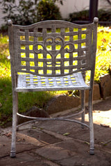 Cast Metal Table And Two Chairs