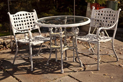 Cast Metal Table And Two Chairs