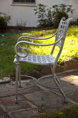 Cast Metal Table And Two Chairs